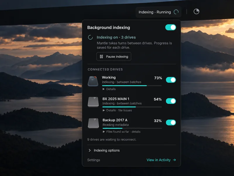 Mantle background-indexing panel over sunset mountains, showing progress for three drives, individual drive switches and Pause indexing.
